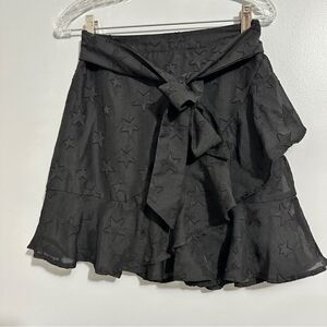 Storia black lace skirt with a front tie.  NWT but washed size S